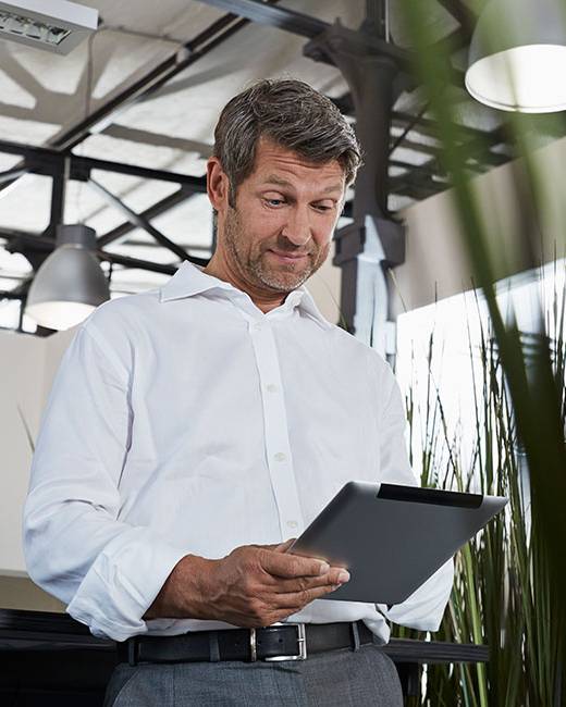 business-man-looking-at-ipad